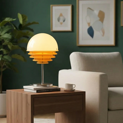 Table lamp on a wooden side table with a cozy living room setting