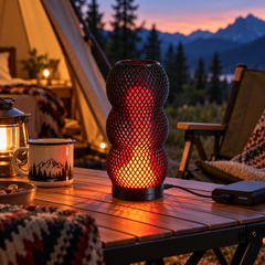 Lava Drip USB lamp connected to a power bank at a sheltered campsite